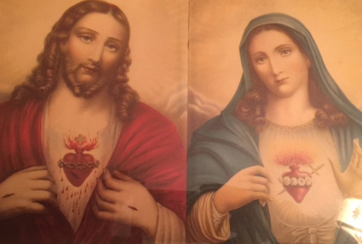 A painting of jesus and mary with the sacred heart on one side.